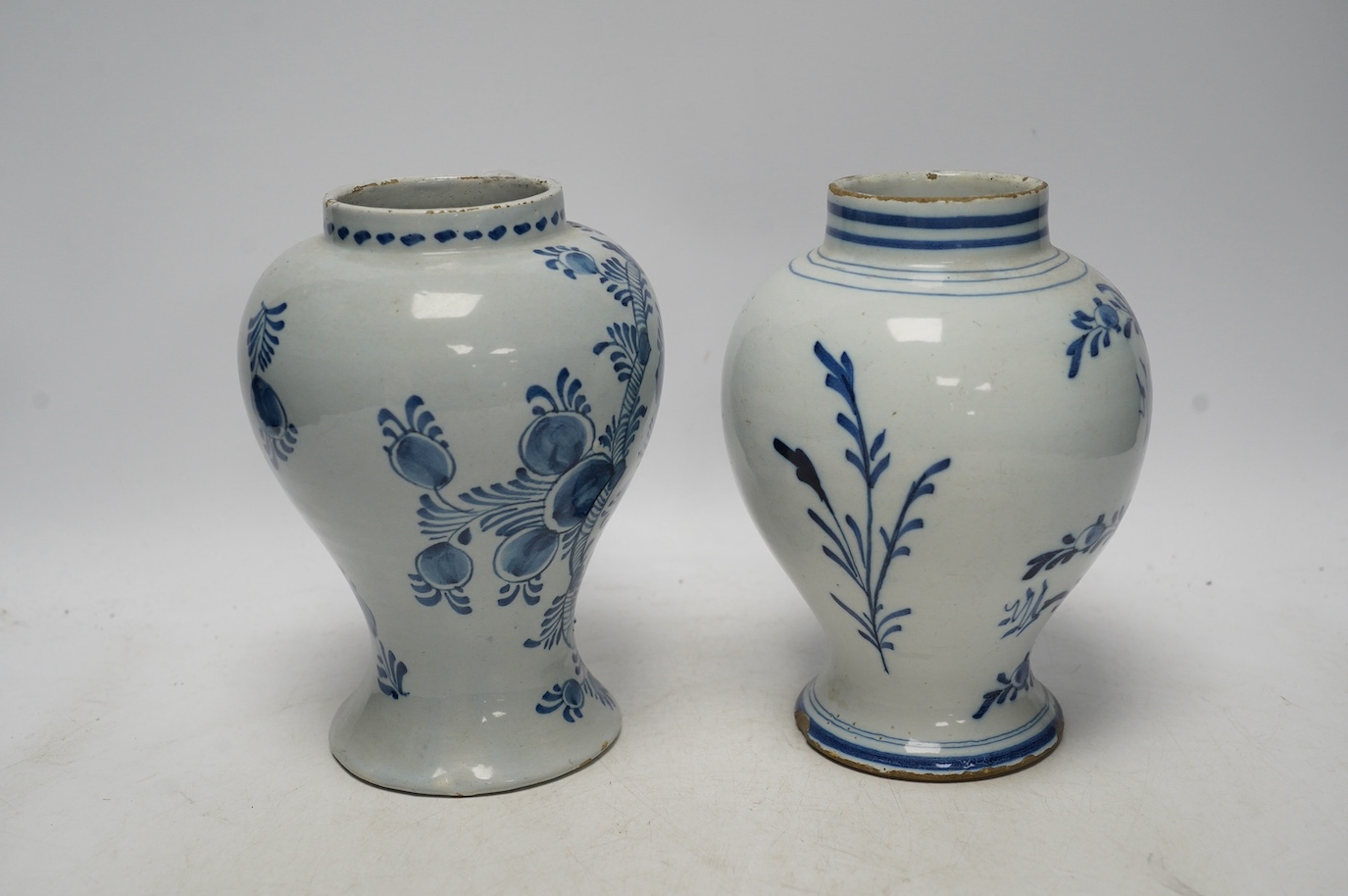 Two 18th century delft blue and white baluster vases, 18.5cm